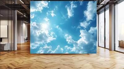 Blue sky with white clouds and bright sun in the daytime. Wall mural