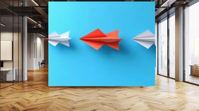 Three paper airplanes, one red, two white, on a blue background. Wall mural