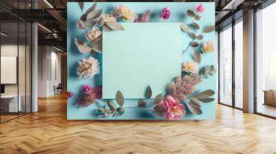 Flowers composition. Paper blank, pink flowers on a pastel blue background Wall mural