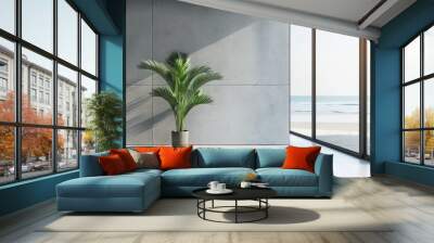 Serene indoor oasis: lush greenery on white floor against modern concrete wall, lounge area with coffee table by glass window overlooking ocean - luxury beach house interior design concept Wall mural