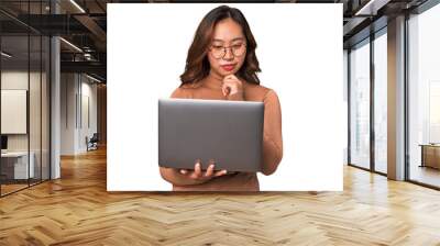 A young asian woman working with her laptop thinking about an idea Wall mural