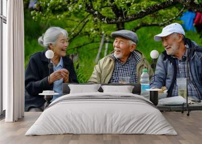 elderly asian people enjoy eating and drinking water in the garden Wall mural