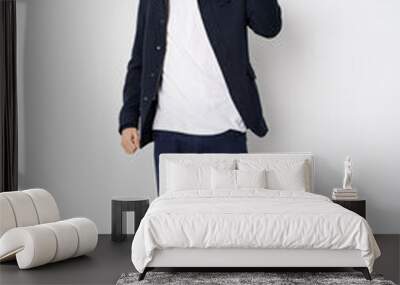 Full body young caucasian man isolated showing fist to camera, aggressive facial expression. Wall mural