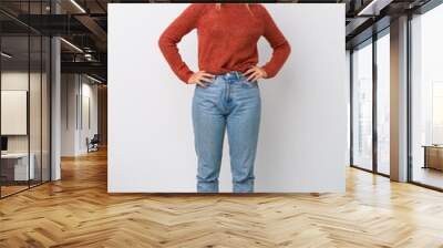 Full body young caucasian woman confident keeping hands on hips. Wall mural