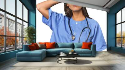 Hispanic nurse in uniform with stethoscope touching back of head, thinking and making a choice. Wall mural