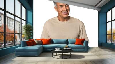 Middle-aged Latino man relaxed and happy laughing, neck stretched showing teeth. Wall mural