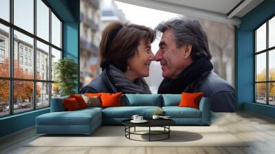 Portrait of a happy senior couple in Paris, France. They are kissing. Wall mural