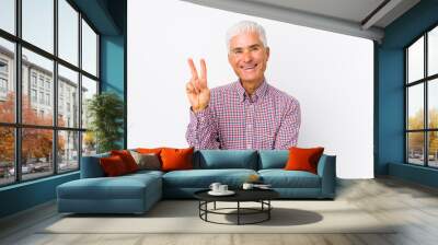 Senior caucasian man isolated showing number two with fingers. Wall mural