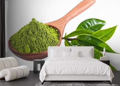 Wooden spoon with matcha powder and tea leaves on white background, vibrant and natural. Wall mural