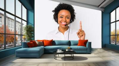 Young african american telemarketer woman isolated showing number one with finger. Wall mural