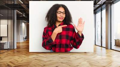 Young african american woman isolated on white background smiling cheerful showing number five with fingers. Wall mural