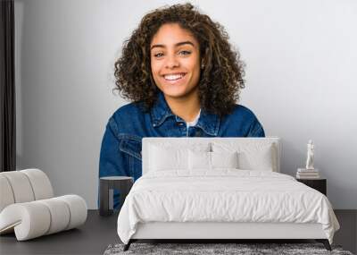 Young african american woman laughing and having fun. Wall mural