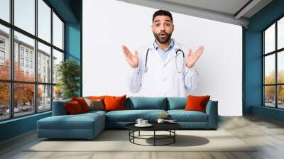 Young arabian doctor man isolated surprised and shocked. Wall mural