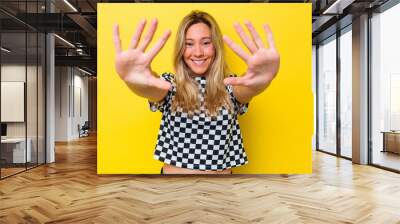 Young australian woman isolated showing number ten with hands. Wall mural