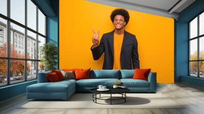 Young business african american man over an orange wall showing number two Wall mural