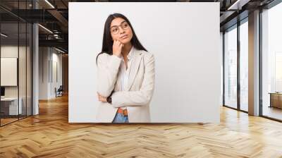 Young business arab woman isolated against a white background who feels sad and pensive, looking at copy space. Wall mural