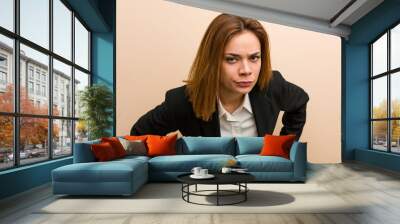 Young caucasian business woman scolding someone very angry. Wall mural