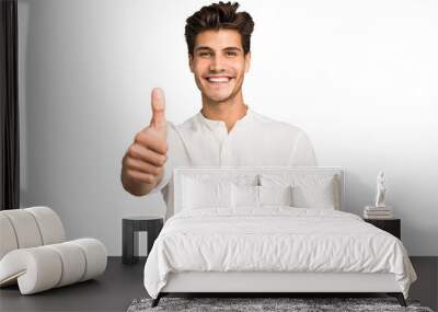 Young caucasian handsome man isolated smiling and raising thumb up Wall mural