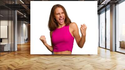 Young caucasian woman isolated cheering carefree and excited. Victory concept. Wall mural