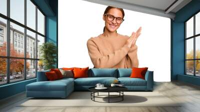 Young caucasian woman isolated feeling energetic and comfortable, rubbing hands confident. Wall mural