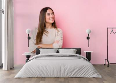 Young caucasian woman posing isolated smiling confident with crossed arms. Wall mural