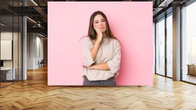 Young caucasian woman posing isolated who is bored, fatigued and need a relax day. Wall mural