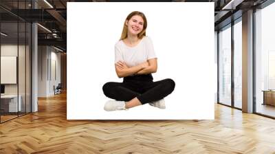 Young caucasian woman sitting on the floor cutout isolated Wall mural