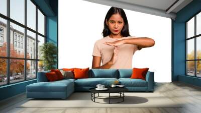 Young Indian woman isolated showing a timeout gesture. Wall mural