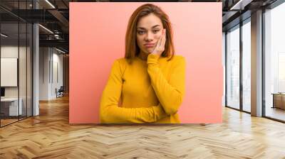 Young pretty young woman who is bored, fatigued and need a relax day. Wall mural