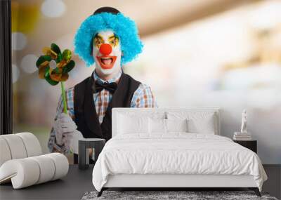 portrait of a funny clown holding a pinwheel Wall mural