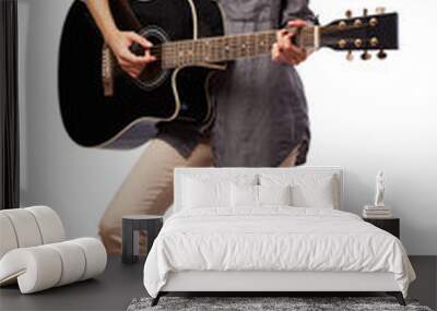 young woman playing guitar isolated on white Wall mural