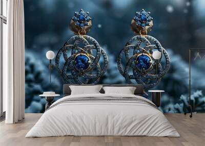 A pair of blue stone earrings resting on snow. Wall mural