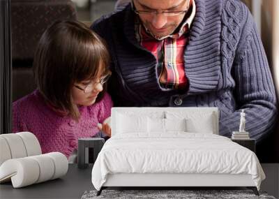 father and daughter on train with smart phone Wall mural