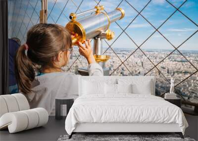 Little girl using the telescope in the Eiffel Tower Wall mural