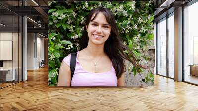 Portrait of a young student girl smiling at camera Wall mural