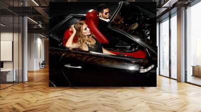 Couple in luxury car. Wall mural