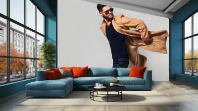 Elegant young handsome main coat wearing glasses. Studio fashion portrait. Wall mural