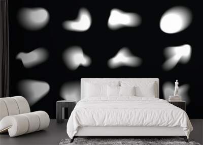 Abstract white blurry shapes, abstract geometric forms with soft edges. Blurry organic shapes. Various silhouette forms with blur effect on black background Wall mural