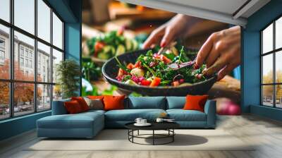 Close up of woman making fresh vegetable salad. Clean eating, dieting, vegan food concept Wall mural