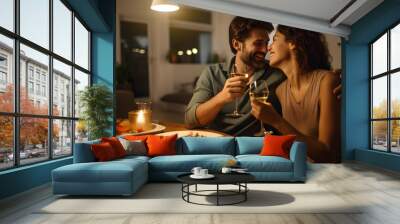 Happy young couple having dinner at home, romantic marriage man and woman celebrating wedding anniversary in kitchen at home Wall mural