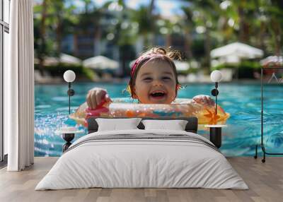 Joyful young girl laughing and floating with a colorful inflatable ring in a bright blue pool, vibrant resort background Wall mural