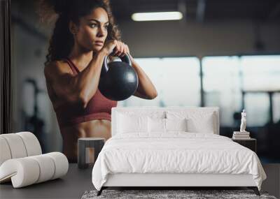 Young woman working out with kettlebells at fitness gym. Lower body legs and feet closeup of strength training legs Wall mural