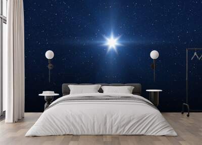 Bright Star on sky. Christmas star of the Nativity of Bethlehem, Nativity of Jesus Christ. Background of the beautiful dark blue starry sky. Wall mural