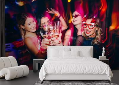 Group of female friends at club drinking wine and having fun. New year party Wall mural