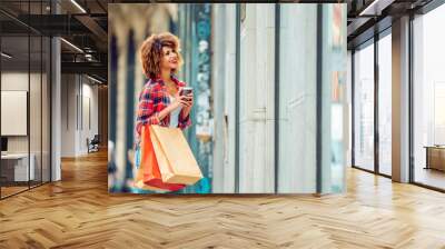 Young african american woman window shopping  Wall mural