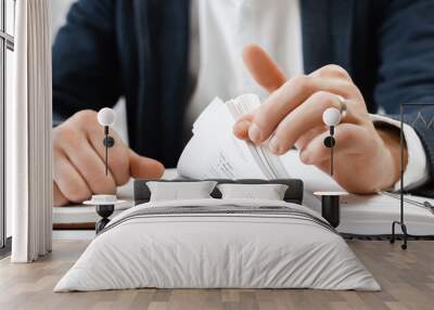 Cropped view of businessman works with financial papers at the table. Finance concept Wall mural