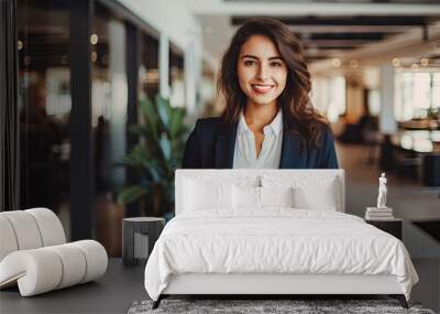 Beautiful elegant business woman in dark business clothes holding tablet and looking at camera smiling inside office building created with Generative AI Technology Wall mural