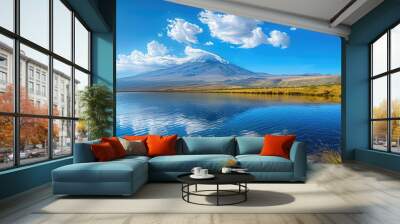 Beautiful view of Mount Kilimanjaro in summer with bright sparkling colors, cloudy sky and calm lake water Wall mural