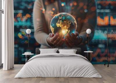 Close-up business woman hands holding shining earth globe symbolizing business innovation strategy and global world market sustainability with charts and graphs Wall mural