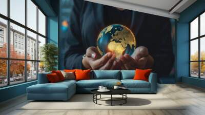 Close-up of business woman hand holding shining earth globe market symbolizing innovation and sustainability business strategy with charts and graphs projected on background Wall mural